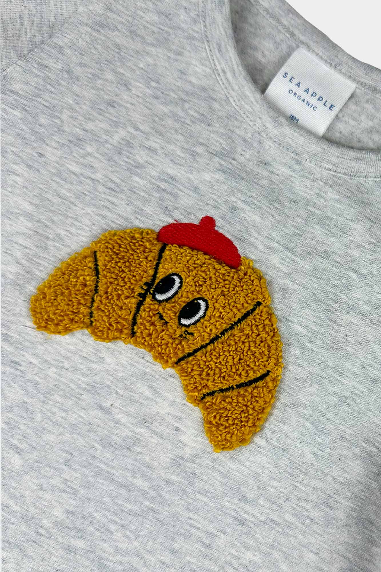Fuzzy Clement Croissant Onesie